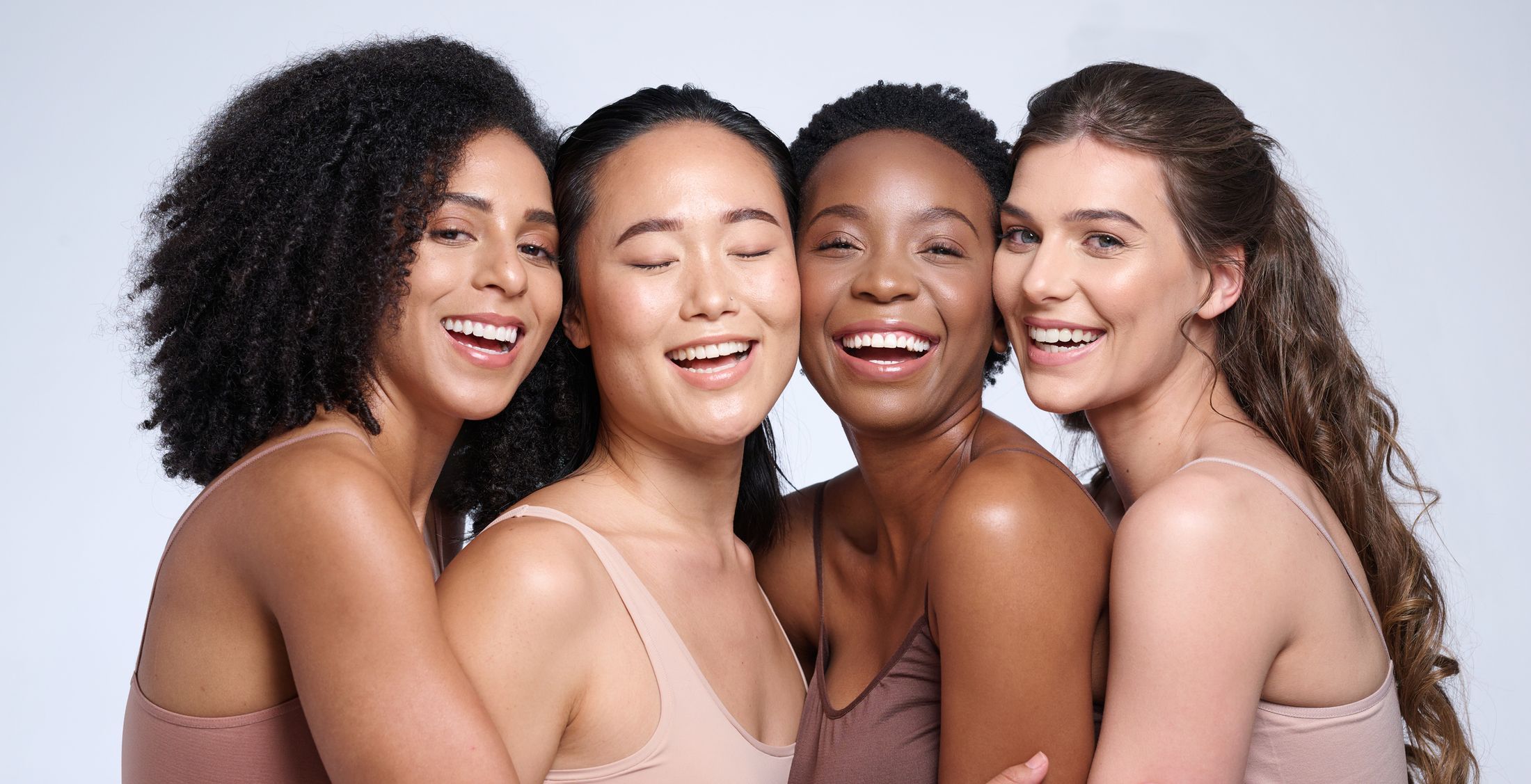 four women smiling